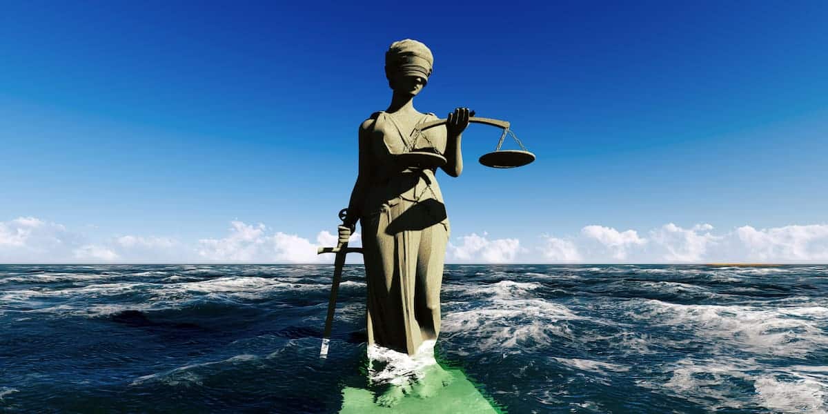 A symbolic statue of Lady Justice standing amidst ocean waves, representing the enforcement of Florida boating laws to ensure compliance and fairness on the waterways